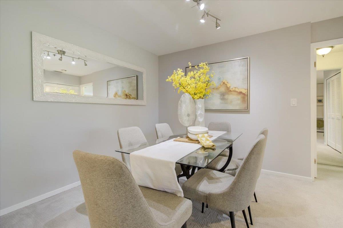 300 Murchison Drive, Unit 311 Millbrae, CA 94030 - Photo 7 of 25 a dining room with furniture and a chandelier