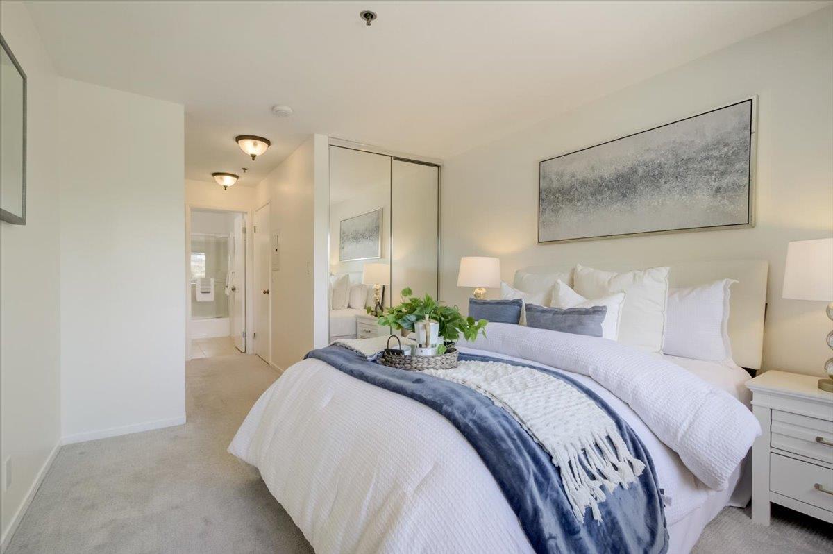 300 Murchison Drive, Unit 311 Millbrae, CA 94030 - Photo 9 of 25 a bedroom with a bed and a painting on the wall