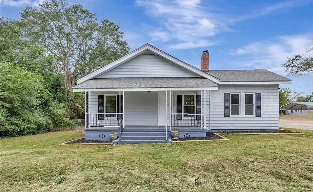 208 Hampton Street Iva, SC 29655 - Photo 1 of 19 This charming home features a welcoming porch, classic siding, and a spacious front yard.