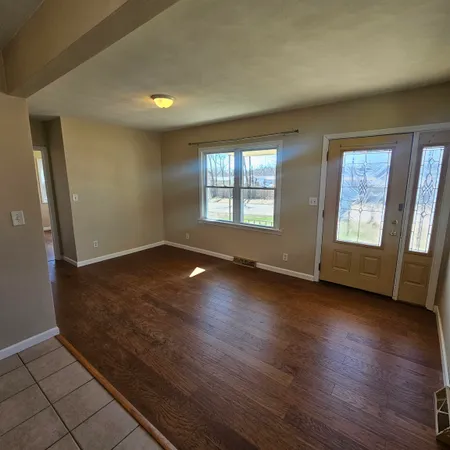 a kitchen with stainless steel appliances a stove a sink and cabinets