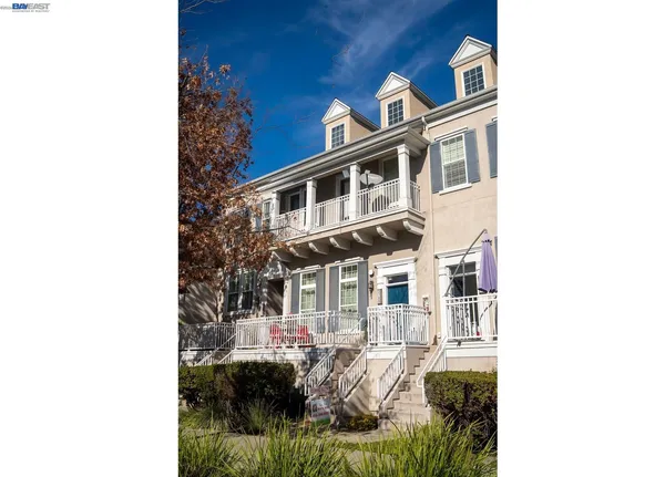 a front view of a house with a parking area