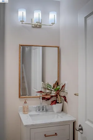 a bedroom with a bed and windows