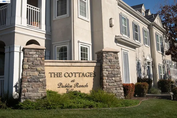 a view of balcony with white fence