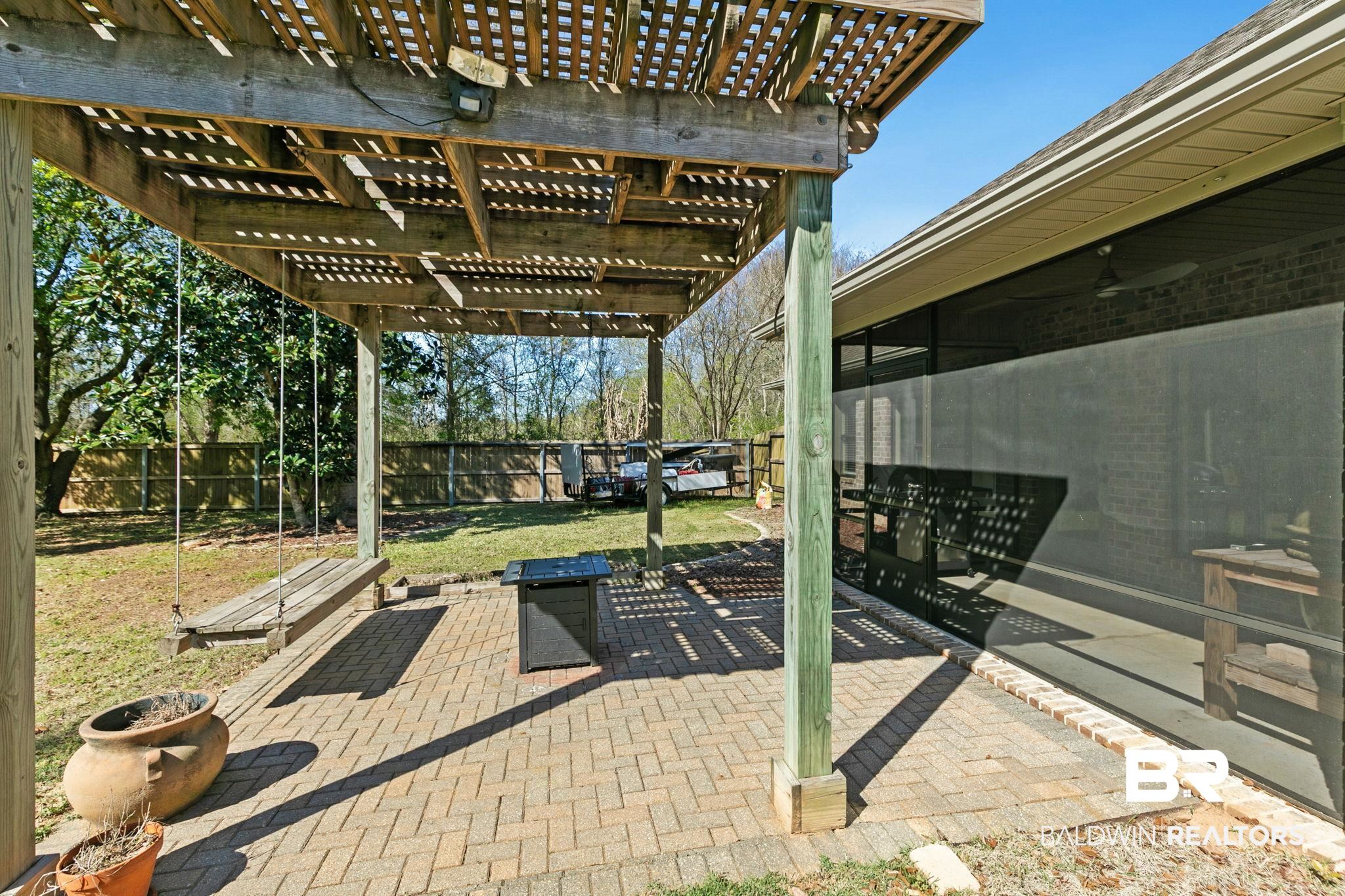 9584 Sanibel Loop Daphne, AL 36526 - Photo 42 of 48 Fenced backyard featuring a patio area and a pergola