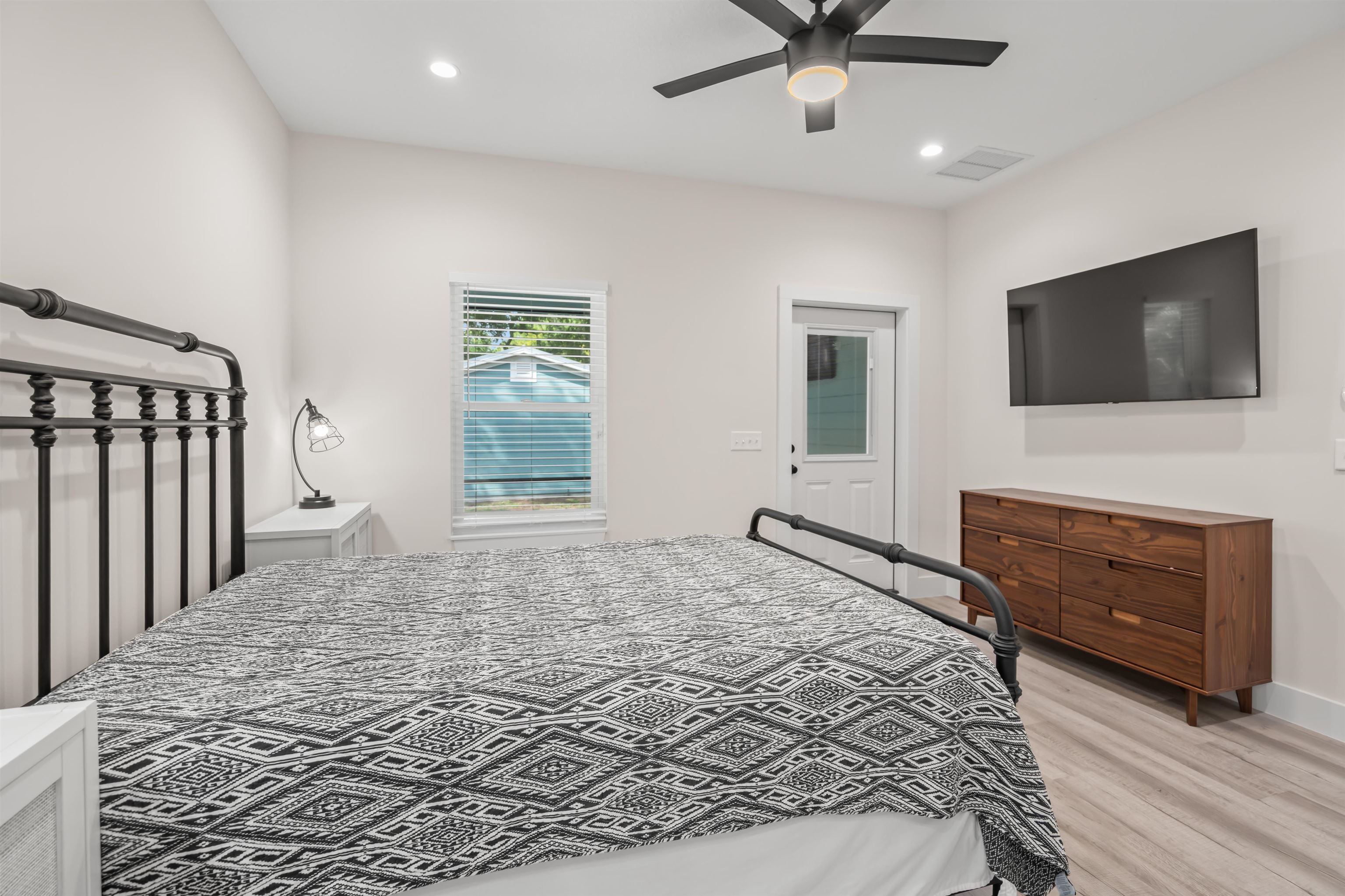141 Webb Street St. Augustine, FL 32084 - Photo 14 of 33 a bedroom with a bed and a flat screen tv