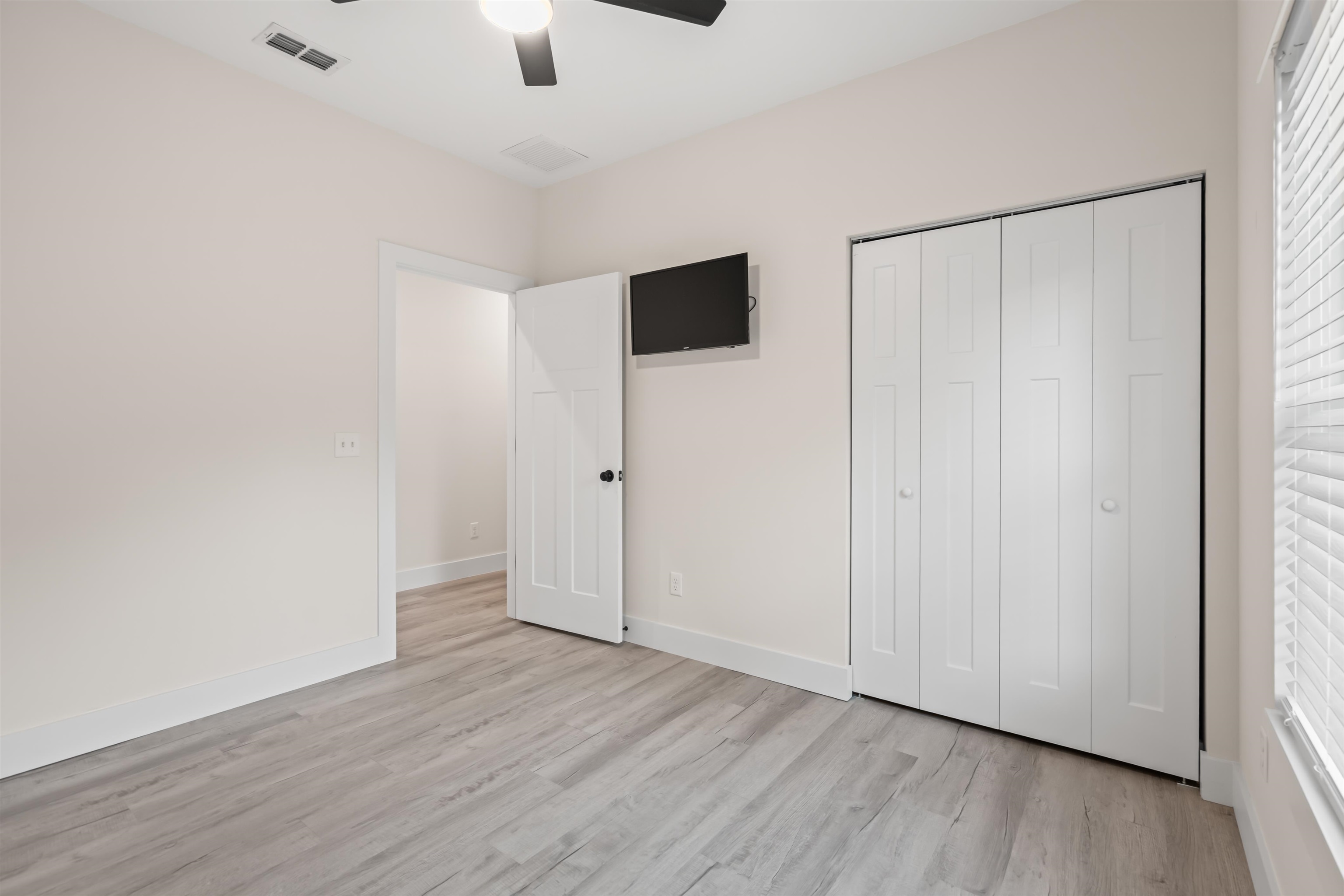 141 Webb Street St. Augustine, FL 32084 - Photo 23 of 33 a view of an empty room with wooden floor