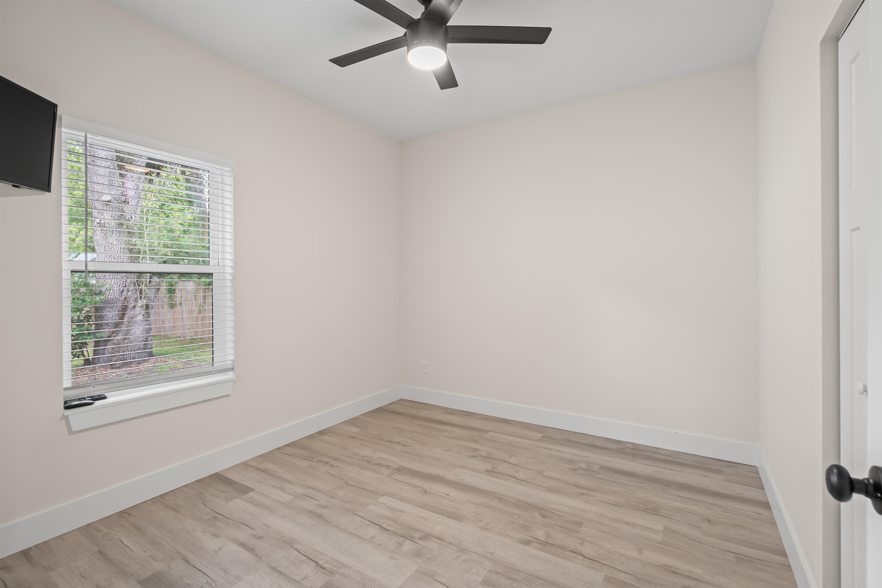 141 Webb Street St. Augustine, FL 32084 - Photo 25 of 33 an empty room with a window and a ceiling fan