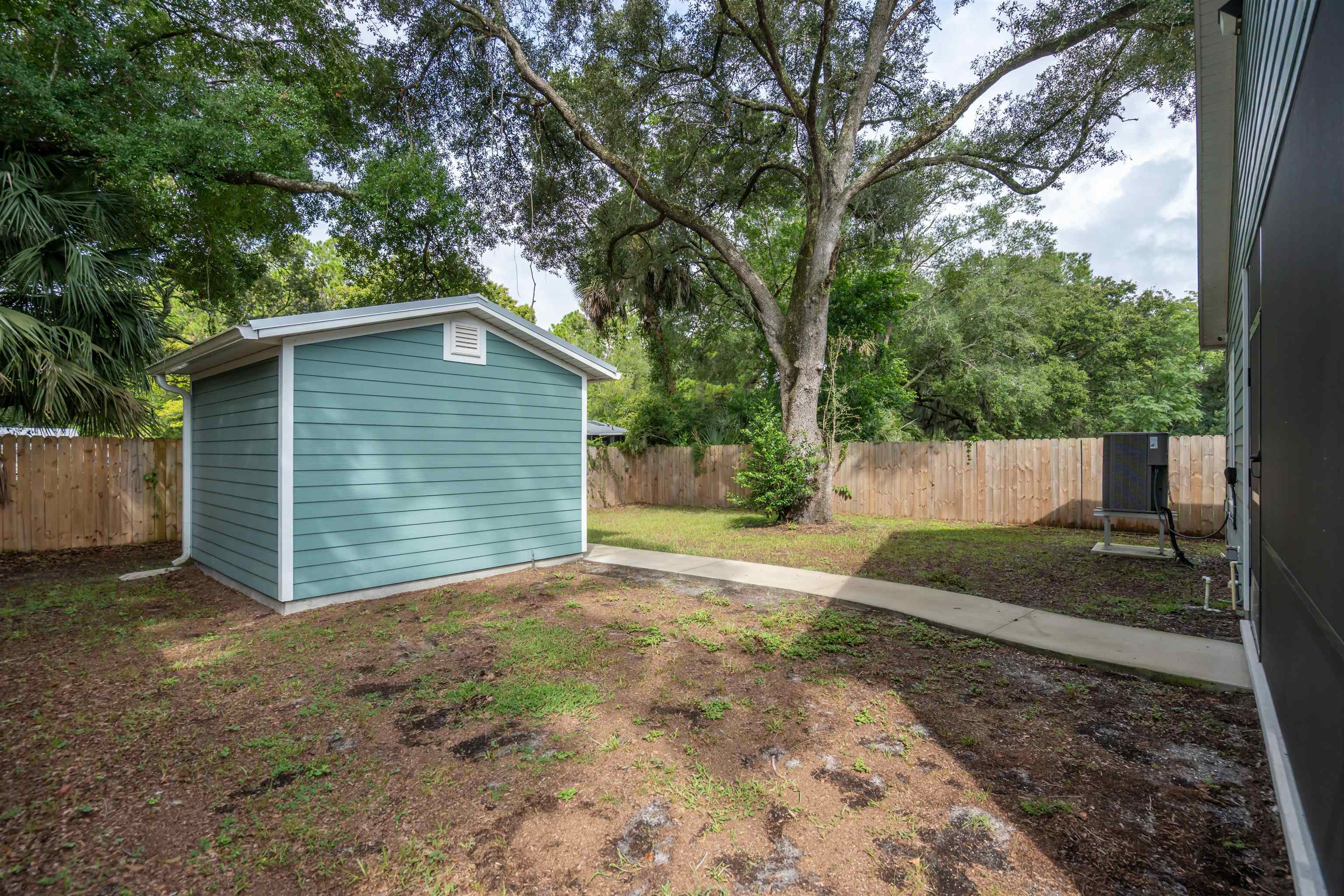 141 Webb Street St. Augustine, FL 32084 - Photo 27 of 33 a view of a house with a yard and tree