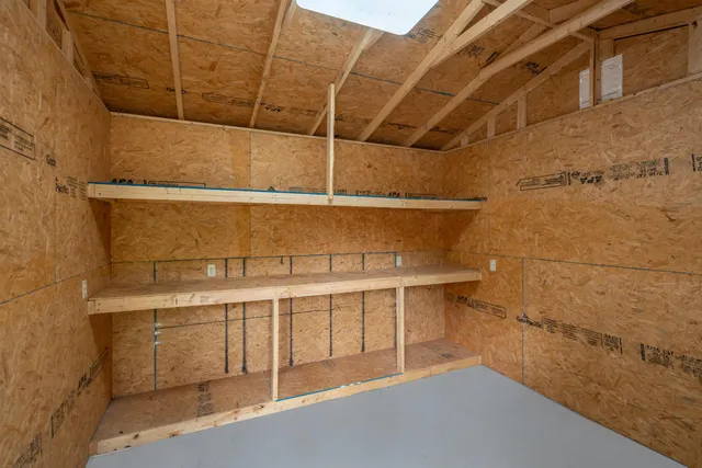 a view of a room with racks on the wall