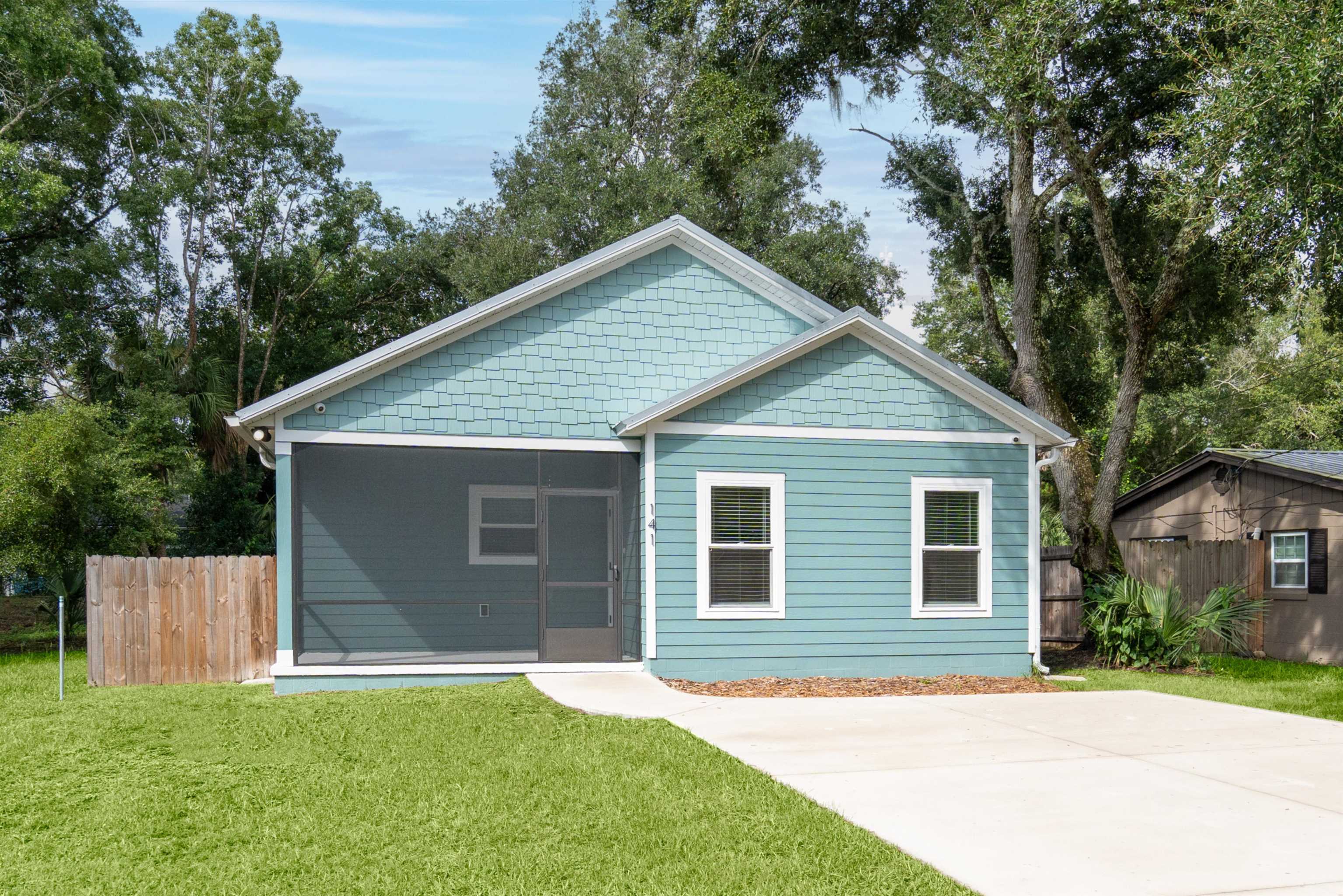 141 Webb Street St. Augustine, FL 32084 - Photo 33 of 33 a front view of house with yard and trees all around