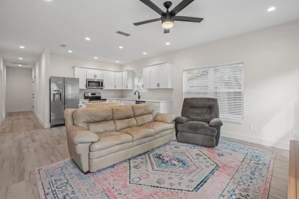 a living room with furniture and a rug