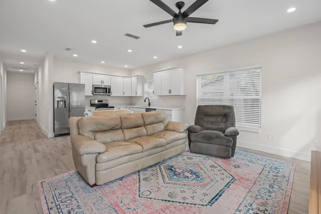 a living room with furniture and a rug
