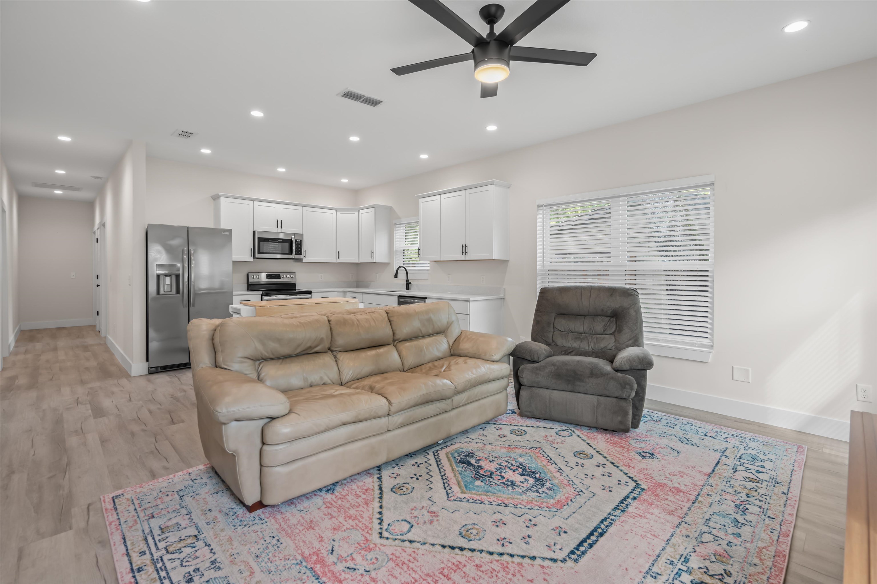 141 Webb Street St. Augustine, FL 32084 - Photo 4 of 33 a living room with furniture and a rug