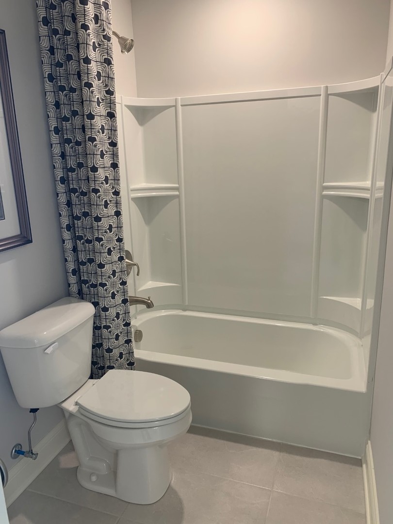 1170 Slade Road South Elgin, IL 60177 - Photo 22 of 29 a bathroom with a toilet and a bathtub