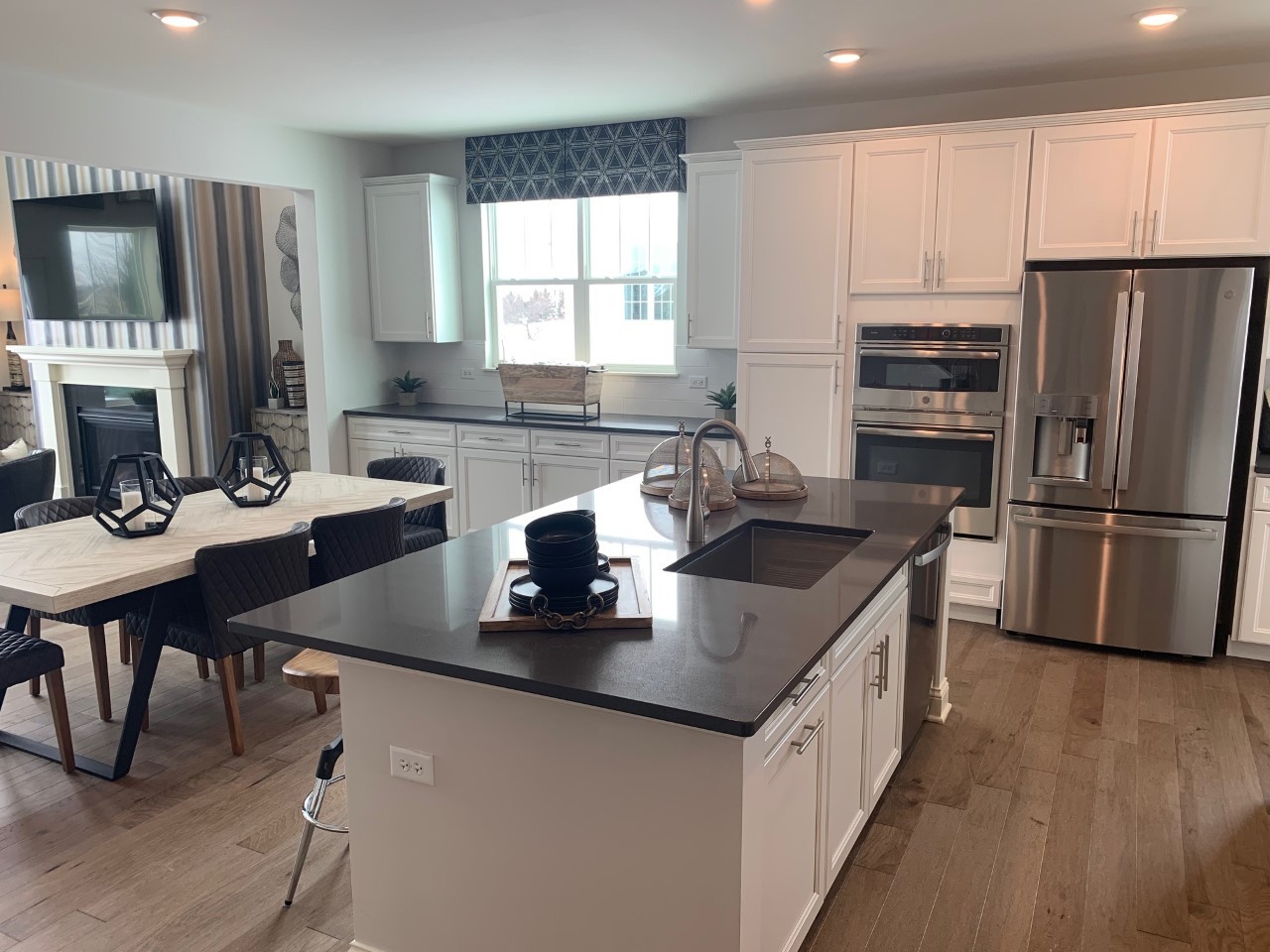 1170 Slade Road South Elgin, IL 60177 - Photo 5 of 29 a kitchen with a sink a kitchen island and stainless steel appliances
