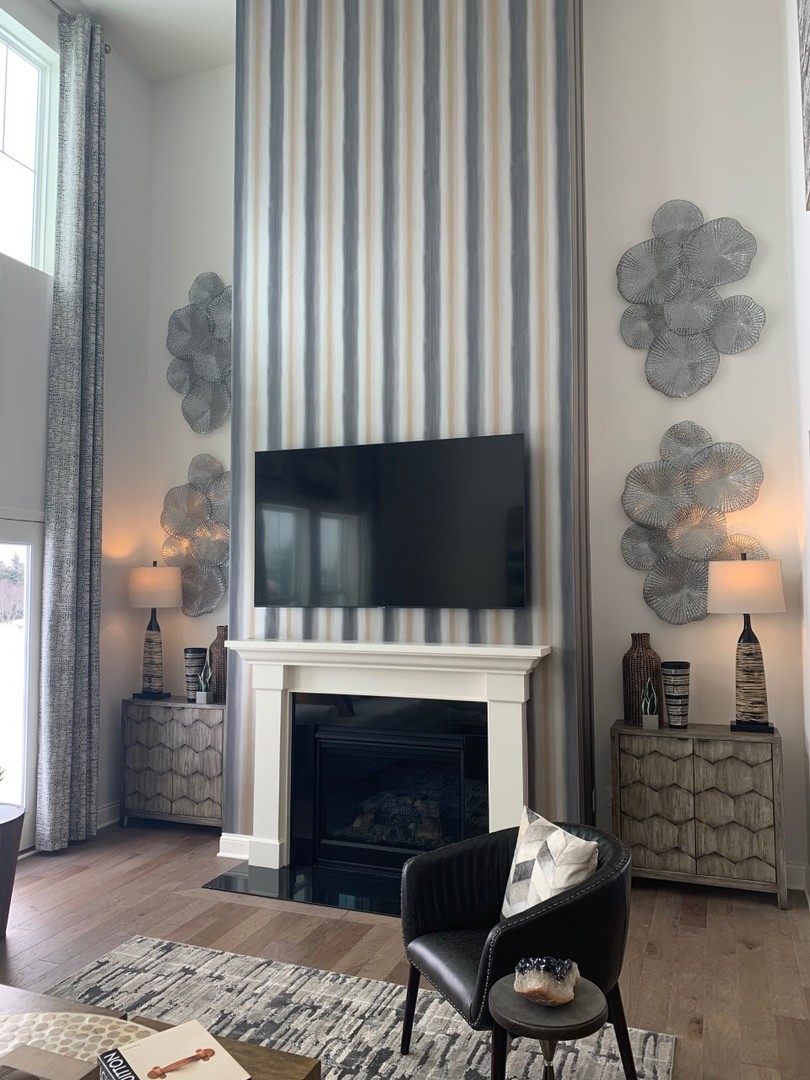 1170 Slade Road South Elgin, IL 60177 - Photo 10 of 29 a living room with furniture a flat screen tv and a fireplace