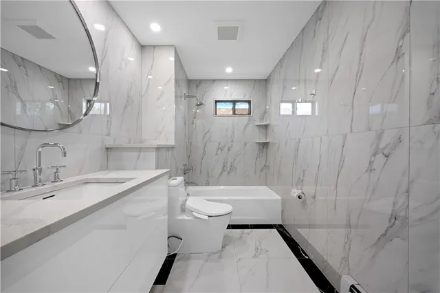 a bathroom with a toilet and a sink