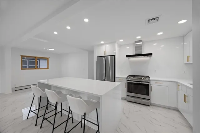 a kitchen that has a sink and a stove