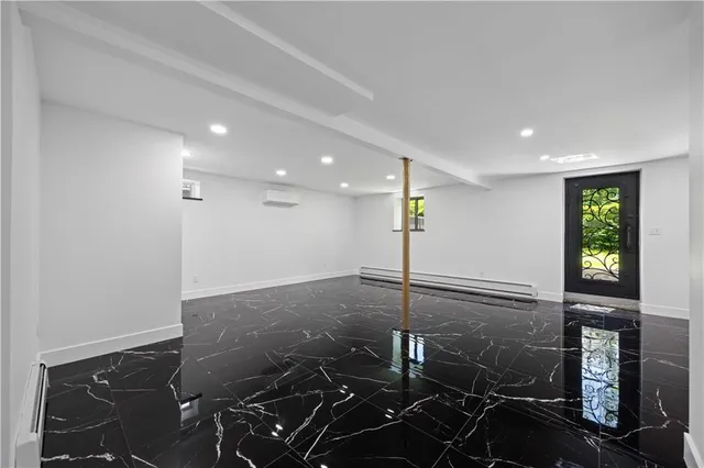 a bathroom with sink and glass door