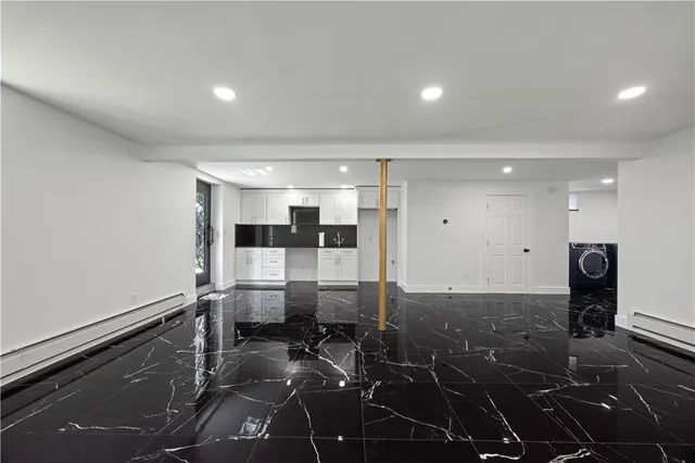 a kitchen with stainless steel appliances a stove refrigerator and microwave