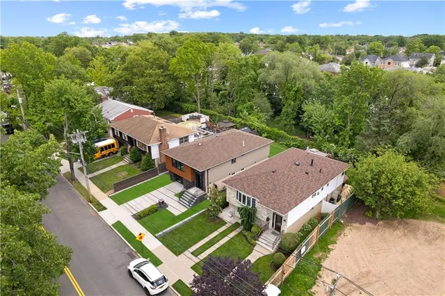 an aerial view of a house with a yard