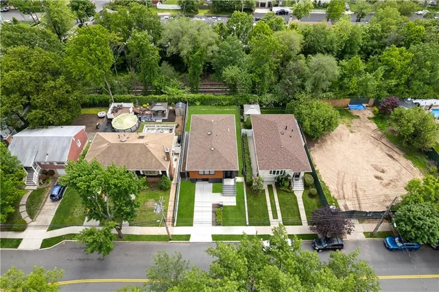 an aerial view of a house with a garden and plants