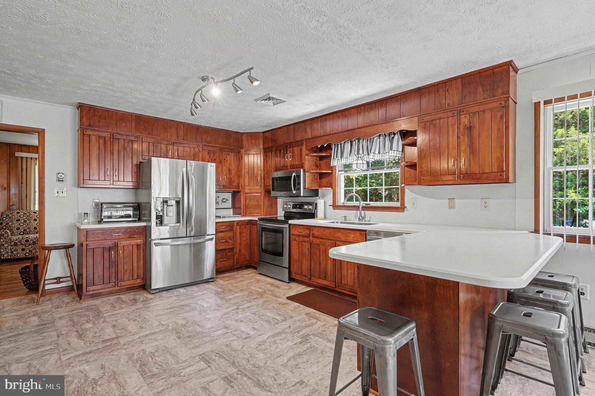 240 Elkmore Road Elkton, MD 21921 - Photo 14 of 57 Attractive Wood Cabinetry and Corian Countertops