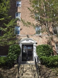 801 Bronx River Road, Unit 2G Bronxville, NY 10708 - Photo 3 of 18 View of exterior entry featuring brick siding