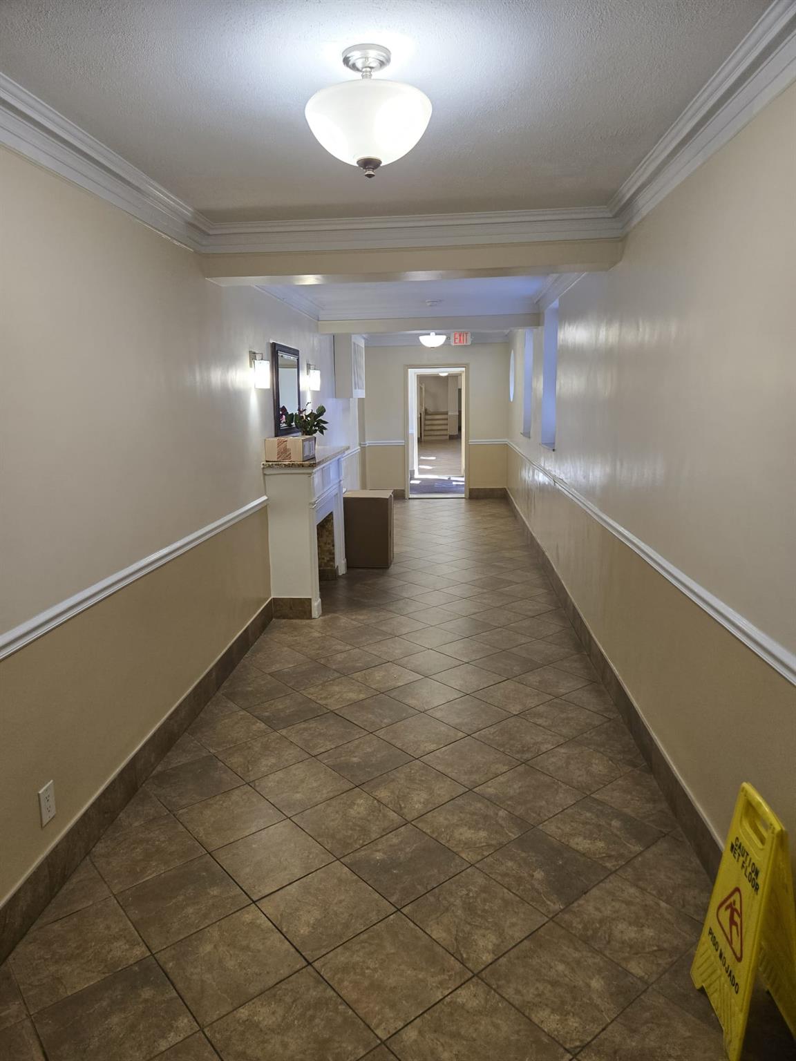 801 Bronx River Road, Unit 2G Bronxville, NY 10708 - Photo 5 of 18 Hall with baseboards, ornamental molding, and a textured ceiling