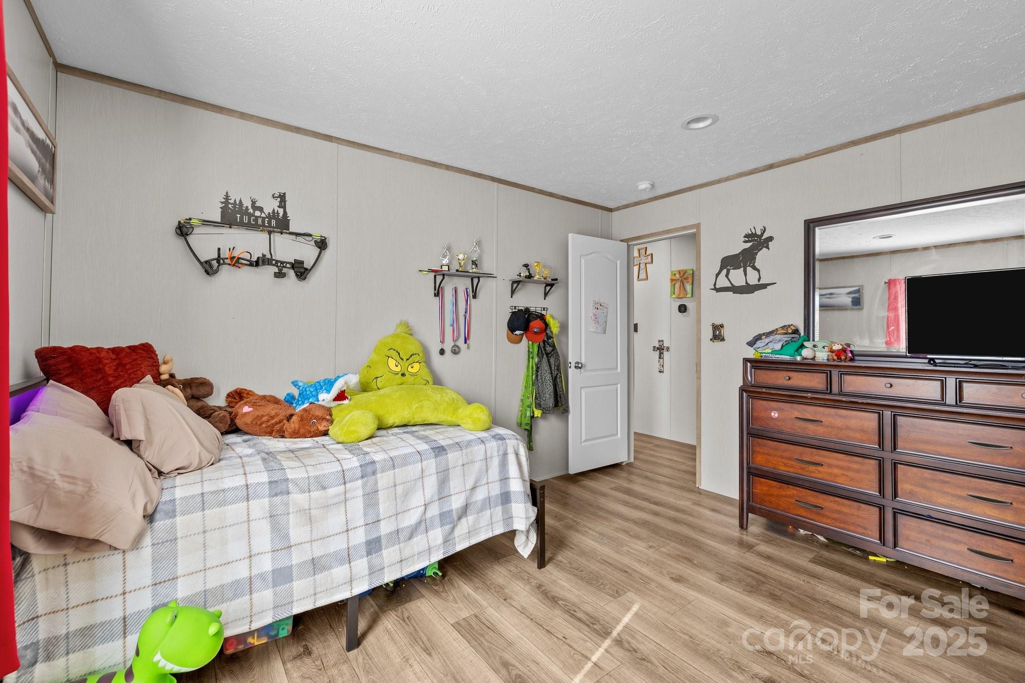 119 Old Hearth Road Clover, SC 29710 - Photo 28 of 39 a bedroom with furniture and a flat screen tv