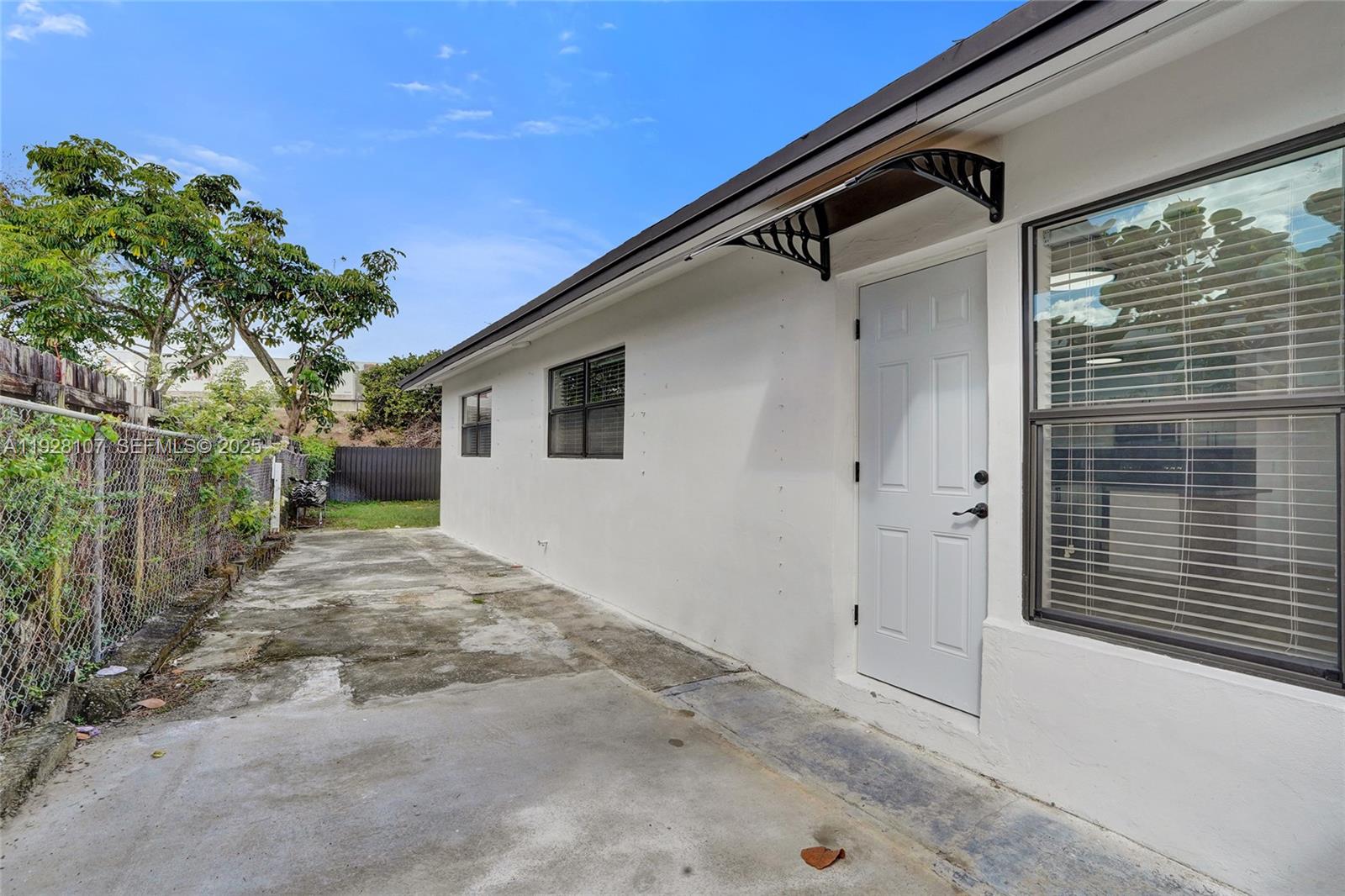 1960 Southwest 68th Way Miramar, FL 33023 - Photo 11 of 42 a view of a house with a yard