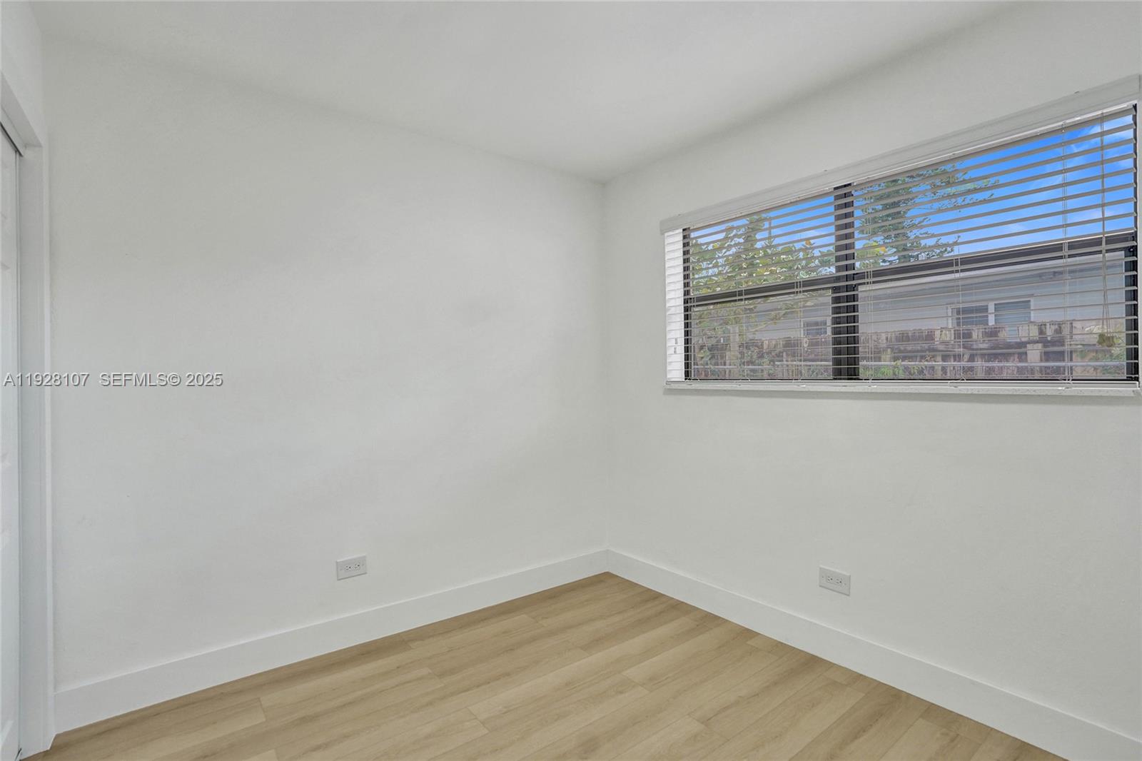 1960 Southwest 68th Way Miramar, FL 33023 - Photo 35 of 42 a view of a room that has wooden floor and cabinets