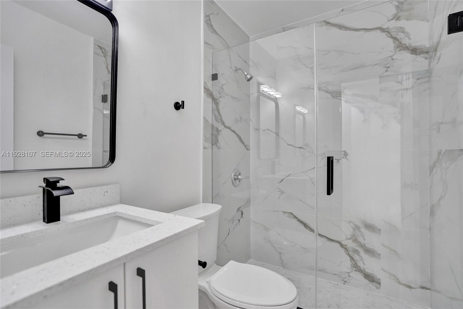 1960 Southwest 68th Way Miramar, FL 33023 - Photo 39 of 42 a bathroom with a sink a toilet and shower