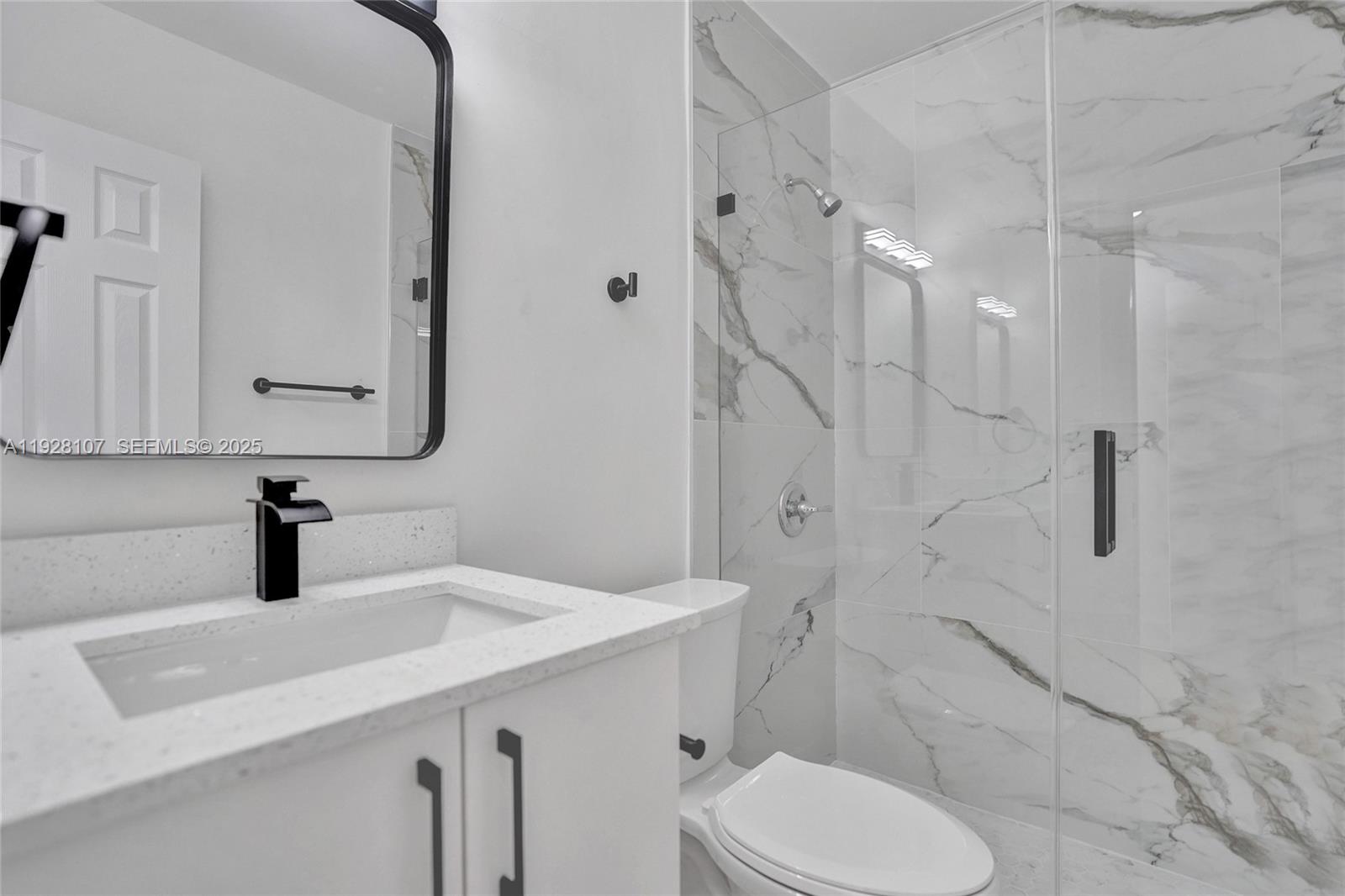 1960 Southwest 68th Way Miramar, FL 33023 - Photo 40 of 42 a bathroom with a sink toilet and shower