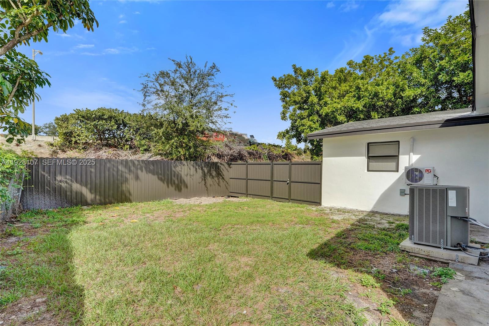 1960 Southwest 68th Way Miramar, FL 33023 - Photo 6 of 42 a house with a tree in front of it