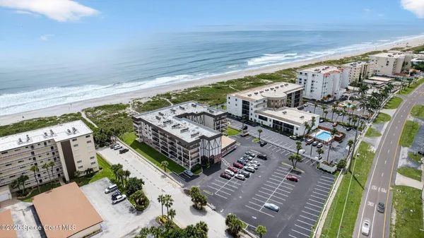 a view of kitchen with furniture and wooden floor