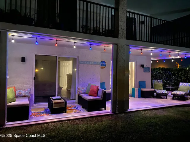 a view of water heater room with wooden floor