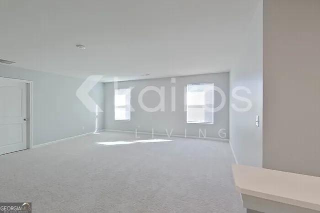 a view of a room with lots of cabinet and mirrors