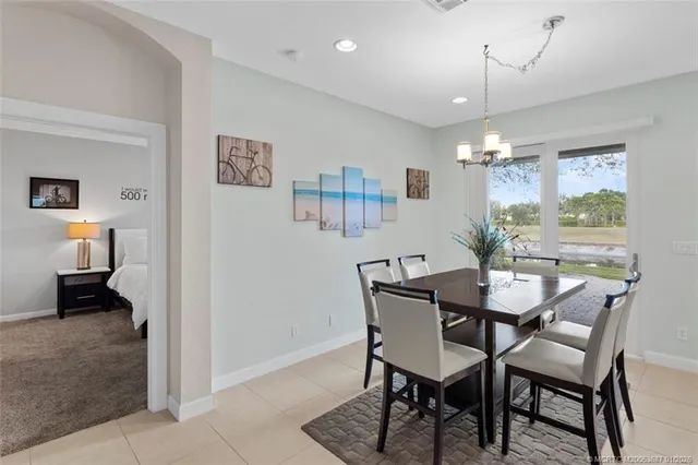 a view of a dining room with furniture window and outside view