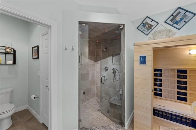a bathroom with a shower and a toilet