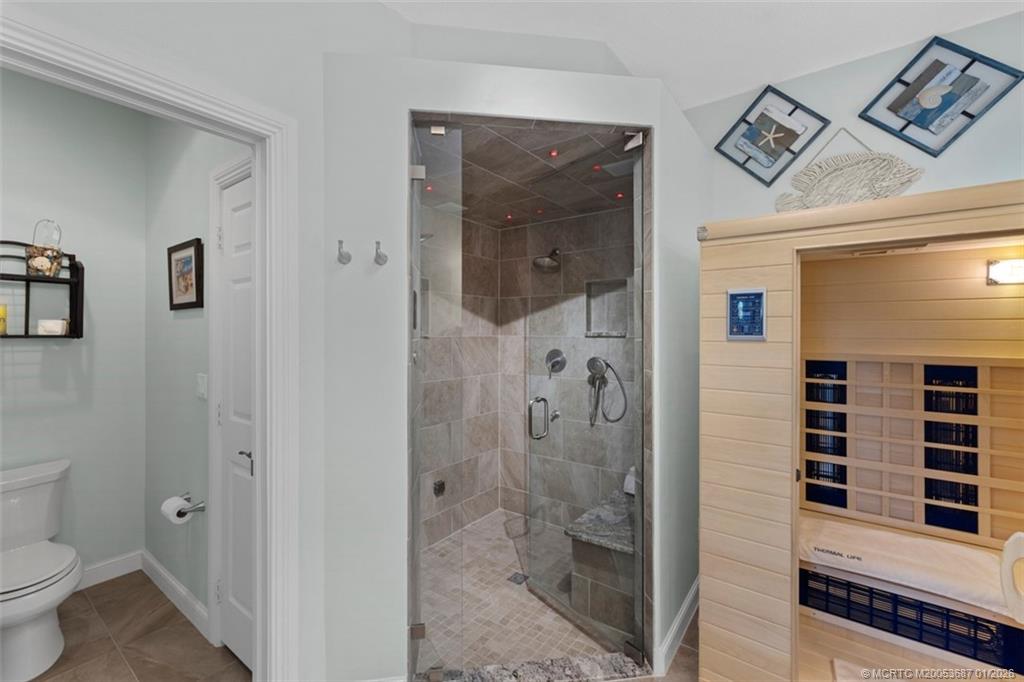 1171 Southeast Kirk Street Stuart, FL 34997 - Photo 22 of 47 a bathroom with a shower and a toilet