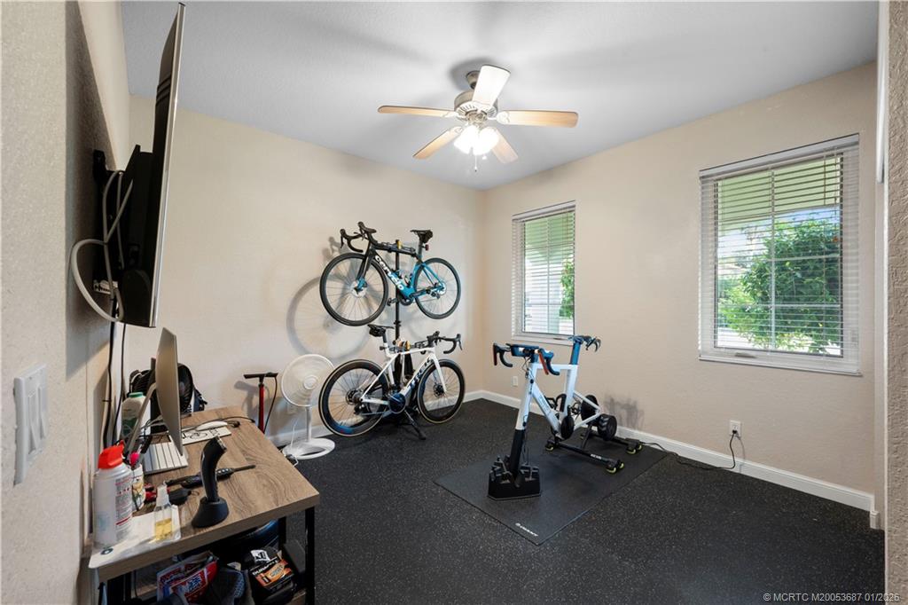 1171 Southeast Kirk Street Stuart, FL 34997 - Photo 26 of 47 a view of a room with gym equipment