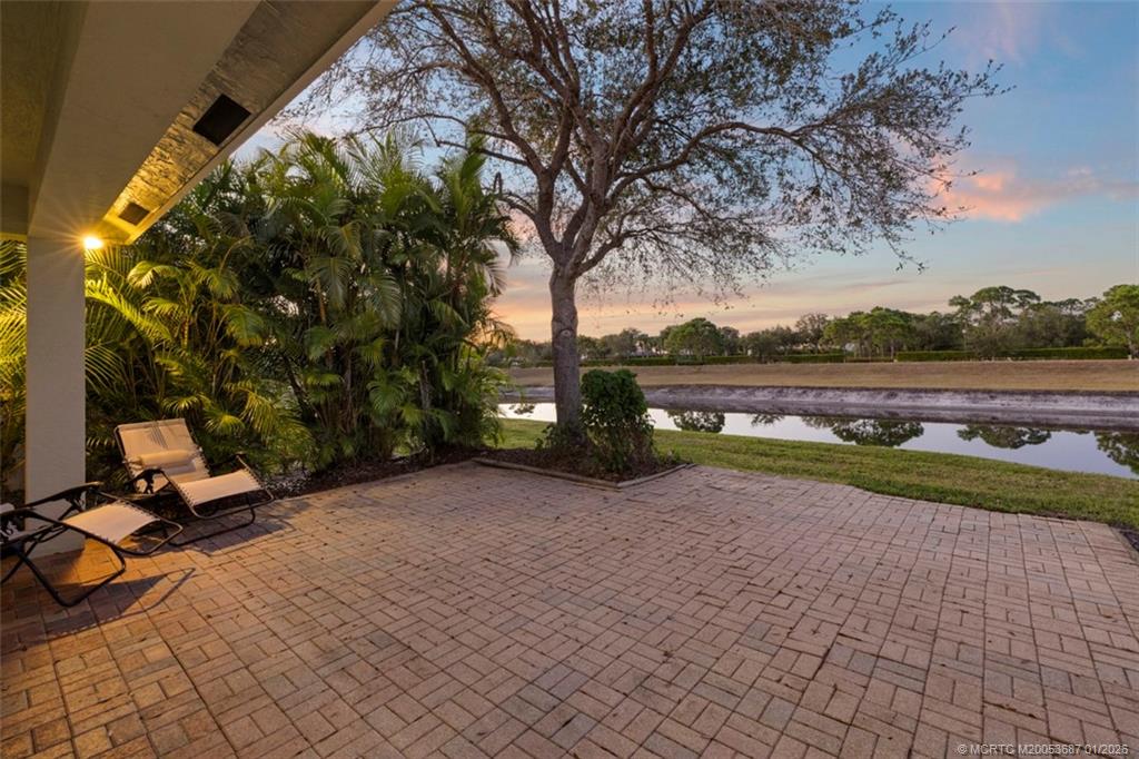 1171 Southeast Kirk Street Stuart, FL 34997 - Photo 28 of 47 a view of swimming pool with an outdoor seating and a yard