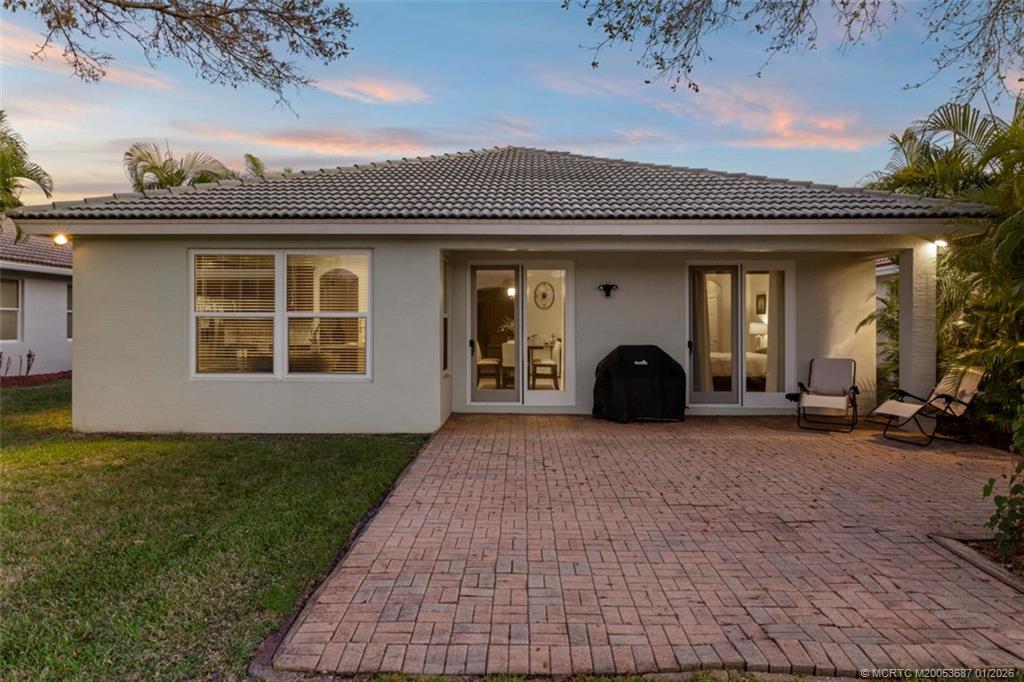 1171 Southeast Kirk Street Stuart, FL 34997 - Photo 31 of 47 a view of a house with a patio