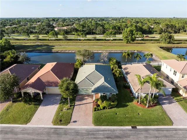 an aerial view of a house with yard swimming pool and outdoor seating
