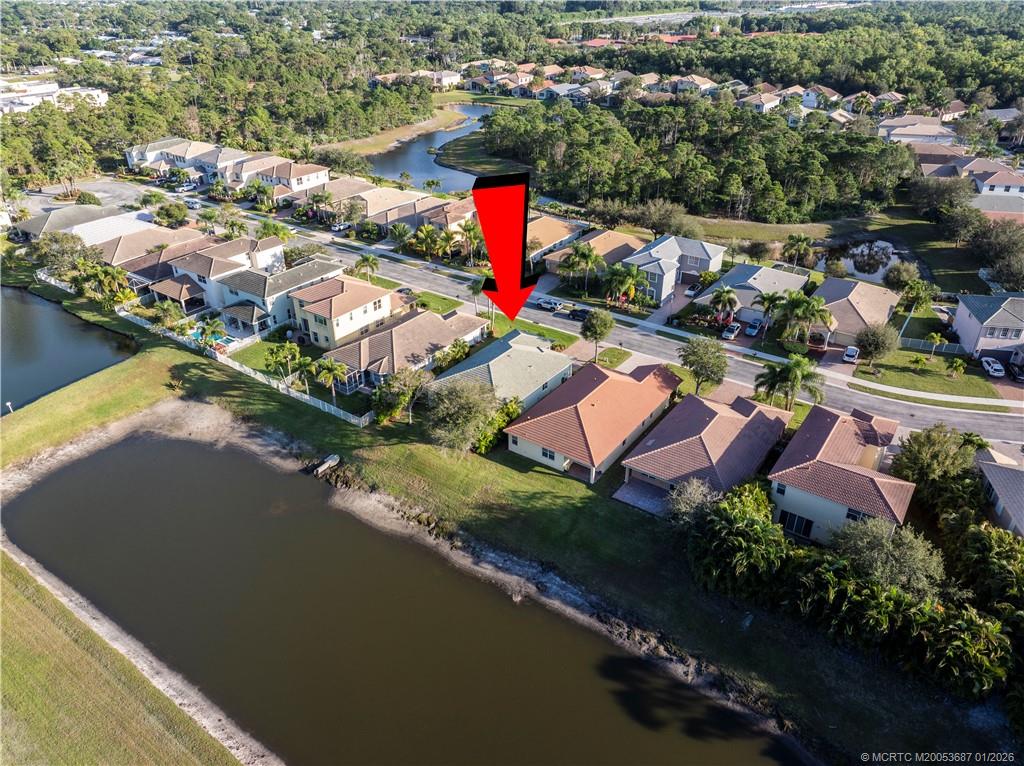 1171 Southeast Kirk Street Stuart, FL 34997 - Photo 35 of 47 an aerial view of residential houses with outdoor space and swimming pool