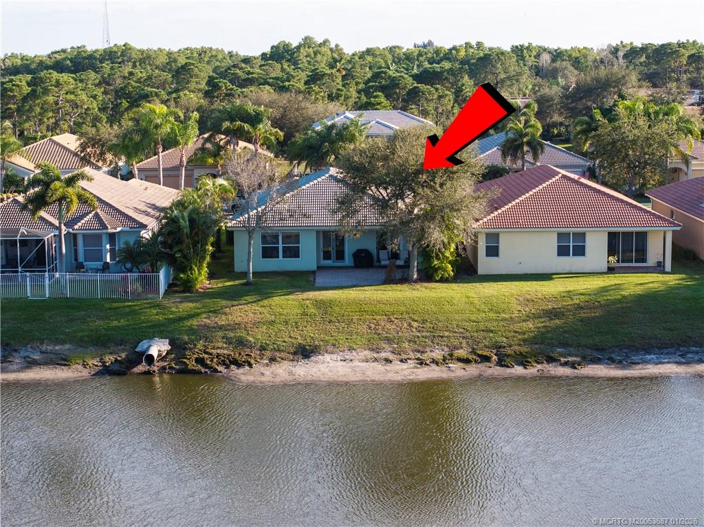1171 Southeast Kirk Street Stuart, FL 34997 - Photo 36 of 47 swimming pool with outdoor seating and yard