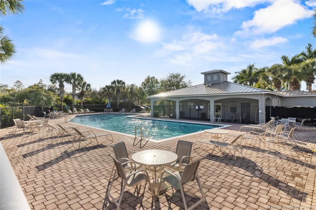 1171 Southeast Kirk Street Stuart, FL 34997 - Photo 39 of 47 a view of a house with backyard and sitting area