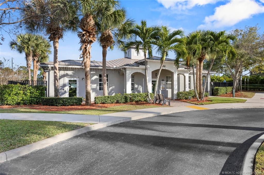 1171 Southeast Kirk Street Stuart, FL 34997 - Photo 44 of 47 front view of a house with a yard