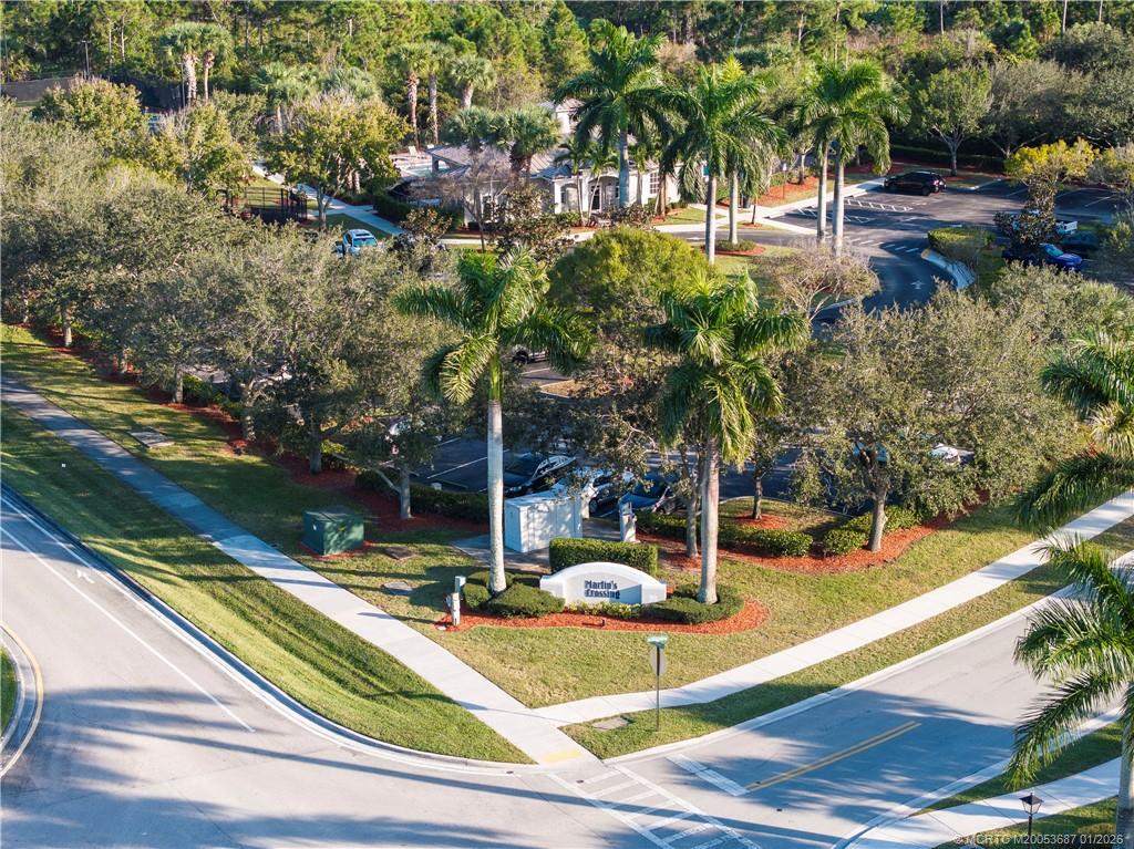 1171 Southeast Kirk Street Stuart, FL 34997 - Photo 47 of 47 a view of a swimming pool with potted plants